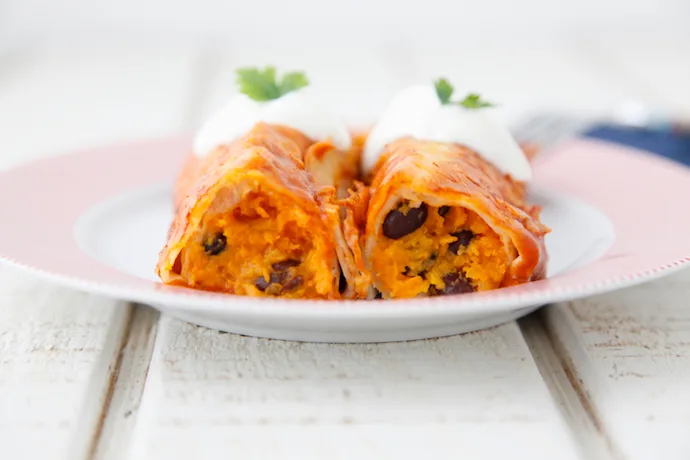 Learning how to freeze meals, like these tasty and kid-friendly Sweet Potato Black Bean Enchiladas, can be a lifesaver during a busy week. | Weelicious