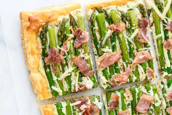 One of our favorite make ahead recipes for Easter brunch: Asparagus Tart using puff pastry. So easy! | Well Plated