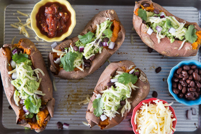 Roast sweet potatoes in the slow cooker using this easy method, then whip up Southwestern Stuffed Sweet Potatoes from What's Gaby Cooking 
