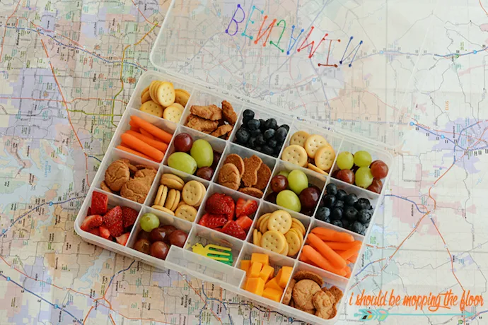 The best travel snack recipes and tips to make being on the road with kids (a little) easier. This brilliant hack of portioning out snacks in tackle boxes is genius! | I Should Be Mopping the Floor