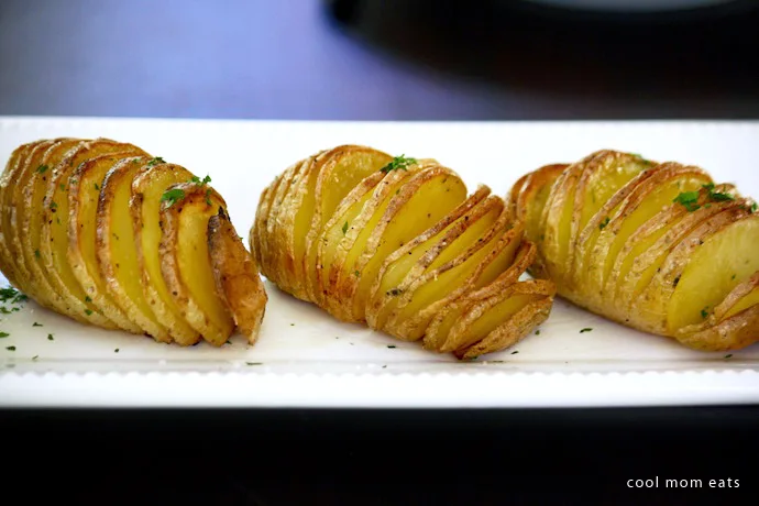 'Tis the season to learn how to make Hasselback potatoes. 5 steps to the most crispy-on-the-outside, tender-on-the-inside potatoes for your holiday table, or really, any day of the week. | Cool Mom Eats