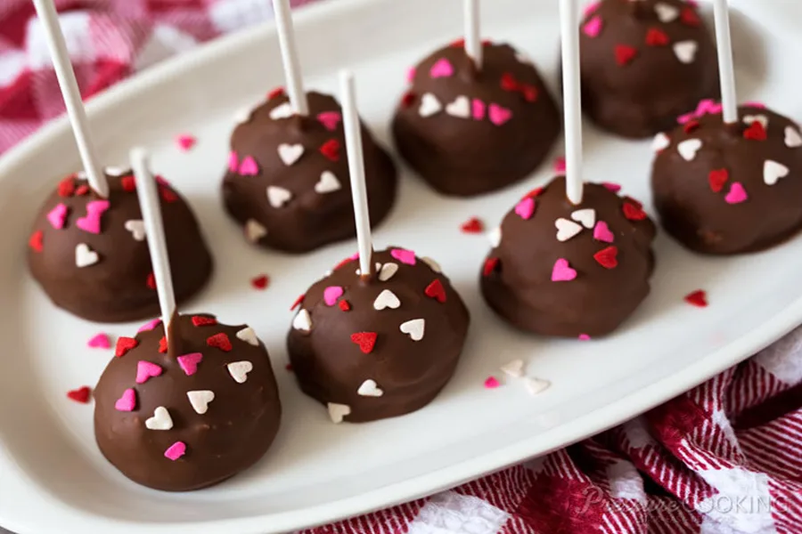 Our favorite Instant Pot dessert recipes, because yay for easy, decadent desserts! Pressure Cooker Chocolate Covered Cheesecake Pops at Pressure Cooking Today