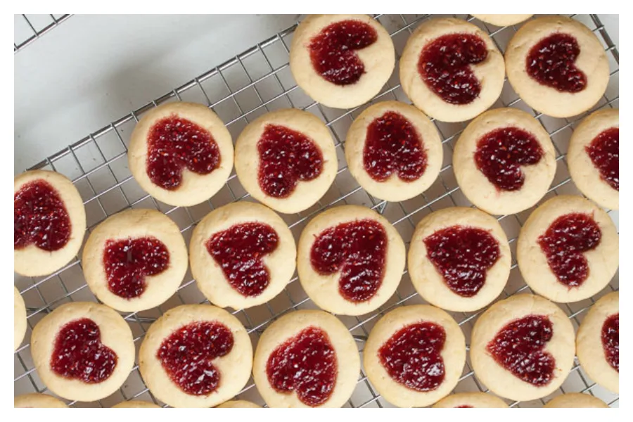 Behind on your Valentine's Day prep work? Skip the convenience store candy and make one of these last-minute Valentine's Day treats instead, including these Heart-Shaped Jam Thumbprint Cookies at Wanna Come With?