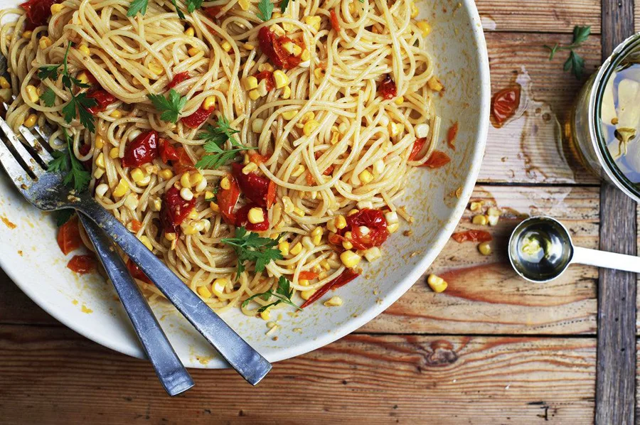 On this week's Cool Mom Eats weekly meal plan: 5 easy, kid-friendly meals for the week ahead, including this summery Pasta with Corn, Tomatoes and Garlic Confit by Phyllis Grant at Food52