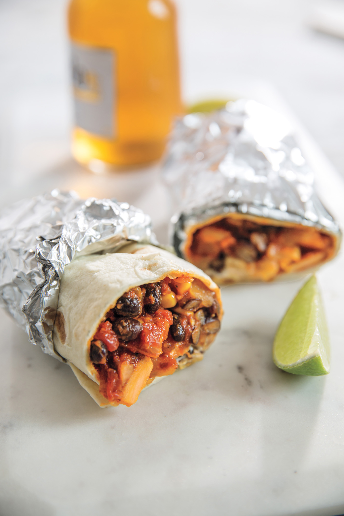 Kitchen Sink Burritos recipe from The Dinner Plan cookbook by Kathy Brennan and Caroline Campion: Not just an easy meal, but one that can be staggered for when everyone's coming home at a different time. A smart family dinner lifesaver! | Cool Mom Eats