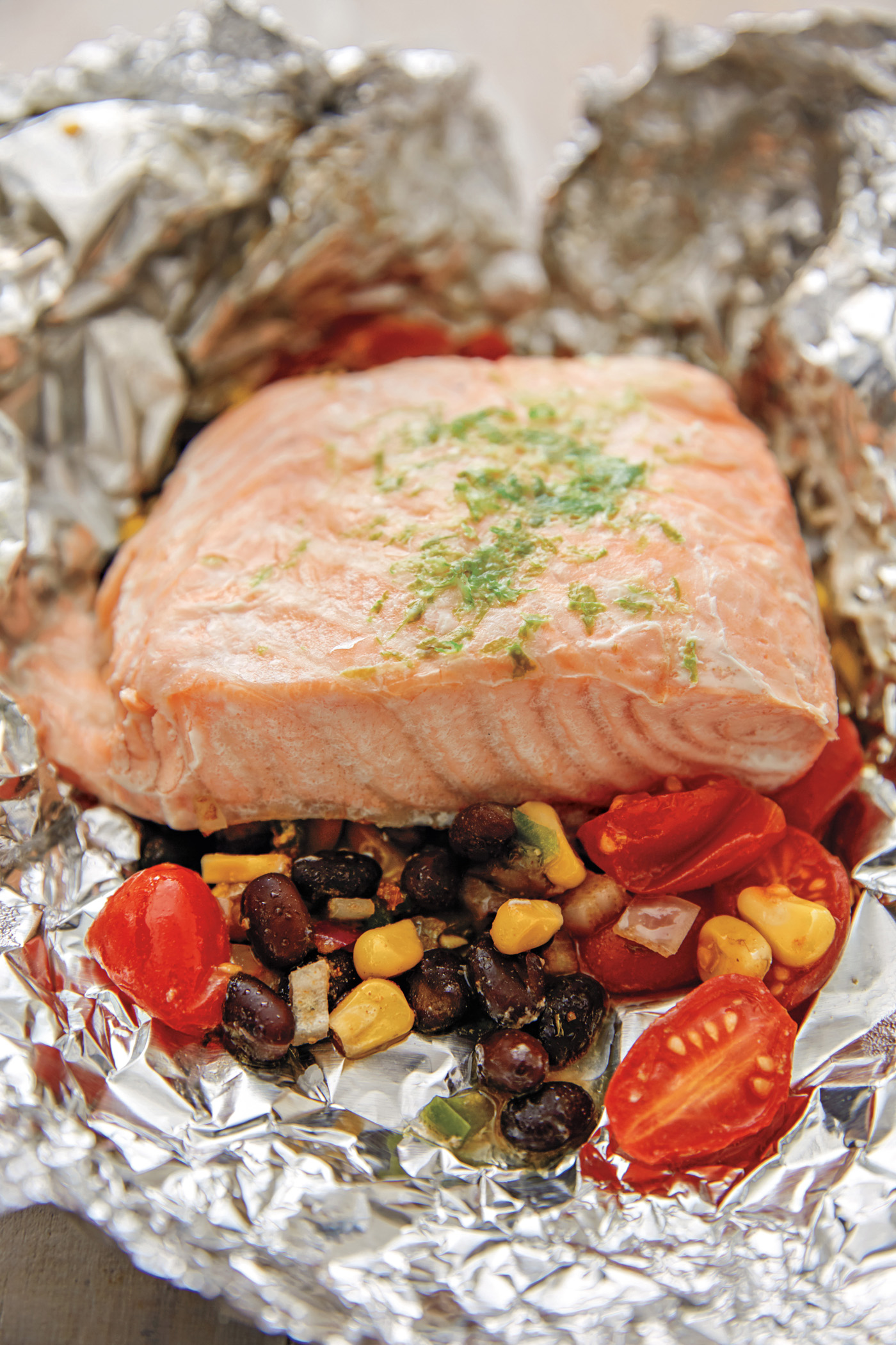 Tex-Mex Salmon in Foil, plus tips on how to cook en papillote (or how to cook in parchment) from The Dinner Plan Cookbook by Kathy Brennan and Caroline Campion | Cool Mom Eats (Photo by Maura McEvoy)