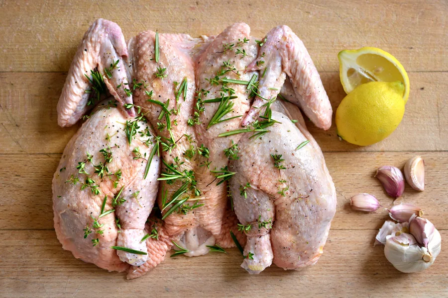 How to spatchcock a turkey or chicken for Thanksgiving, as shown by our own Stacie Billis of Cool Mom Eats