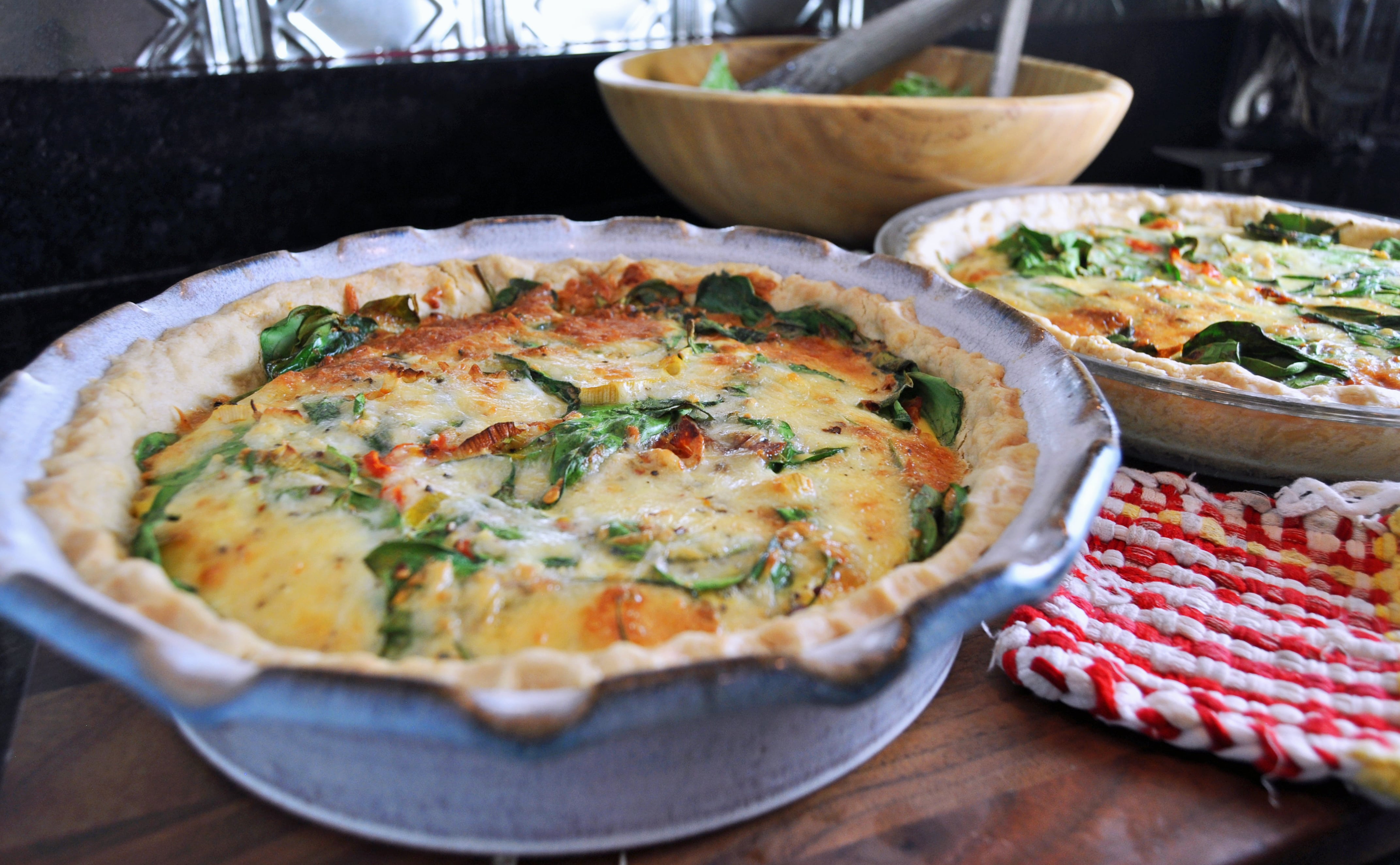 My pat-in-the-pan crust quiches, filled with leftover salami, one wilting leek, a few overripe grape tomatoes, some spinach, and a couple random cheeses. 5 easy kitchen habits you can start today to help save the environment | Cool Mom Eats | Photo by Ann Wolf Postic