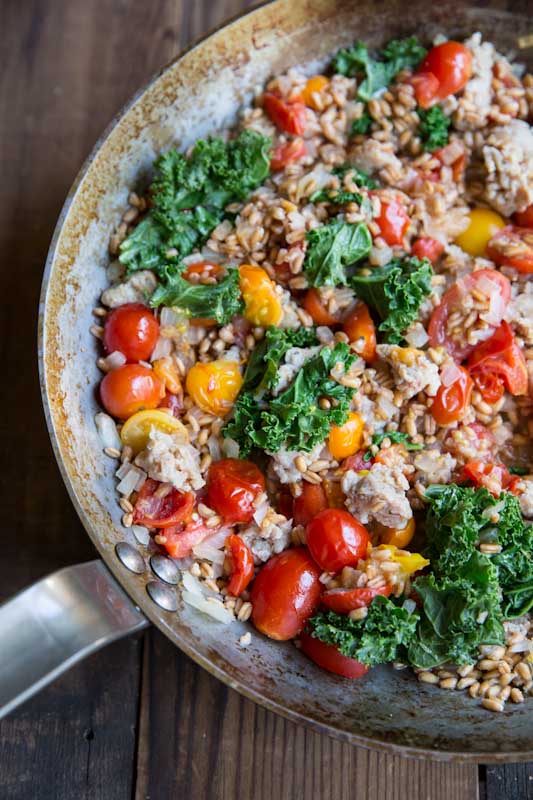 Simple ways to use farro: One-Pan Farro with Tomatoes, Sausage and Kale | The Vintage Mixer