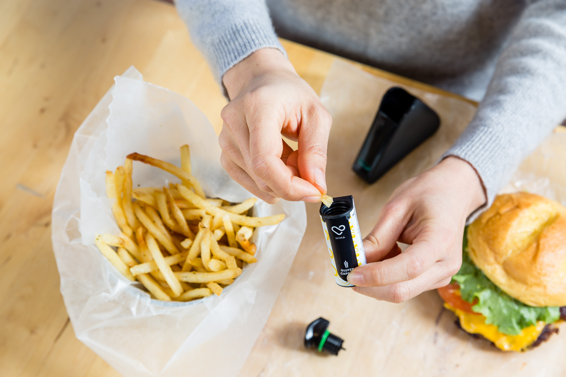 How to use the Nima portable food allergy sensor, using disposable capsules to test for either the presence of peanuts or gluten in the food you eat | coolmomeats.com