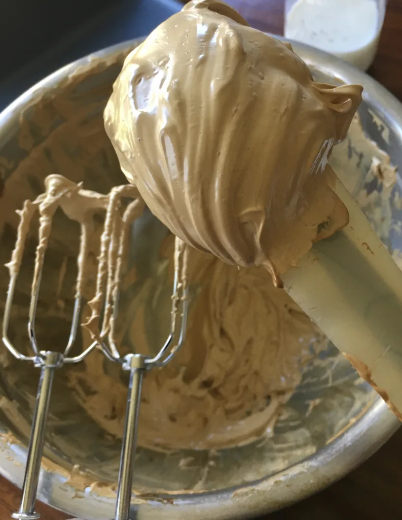 How to make whipped coffee: Note it will change from dark brown sludge to a light fluffy caramel color with the right amount of whipping
