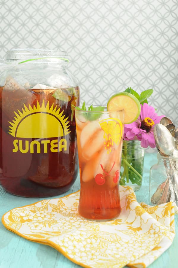 Add fresh fruit to your sun tea | Raspberry Lime sun tea at Two Lucky Spoons