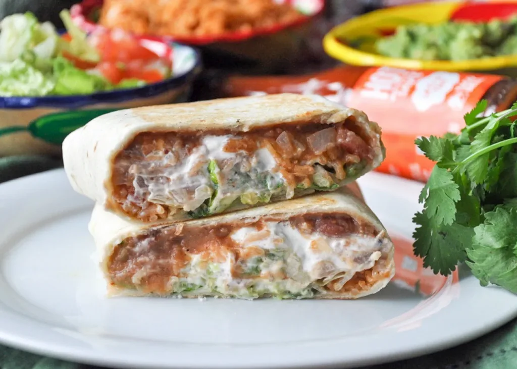 7 Layer Burrito recipe from Honey What's Cooking is a fun way to change up Taco Tuesday -- and an excellent comfort food for fall 7 Layer Burrito recipe from Honey What's Cooking is a fun way to change up Taco Tuesday -- and an excellent comfort food for fall