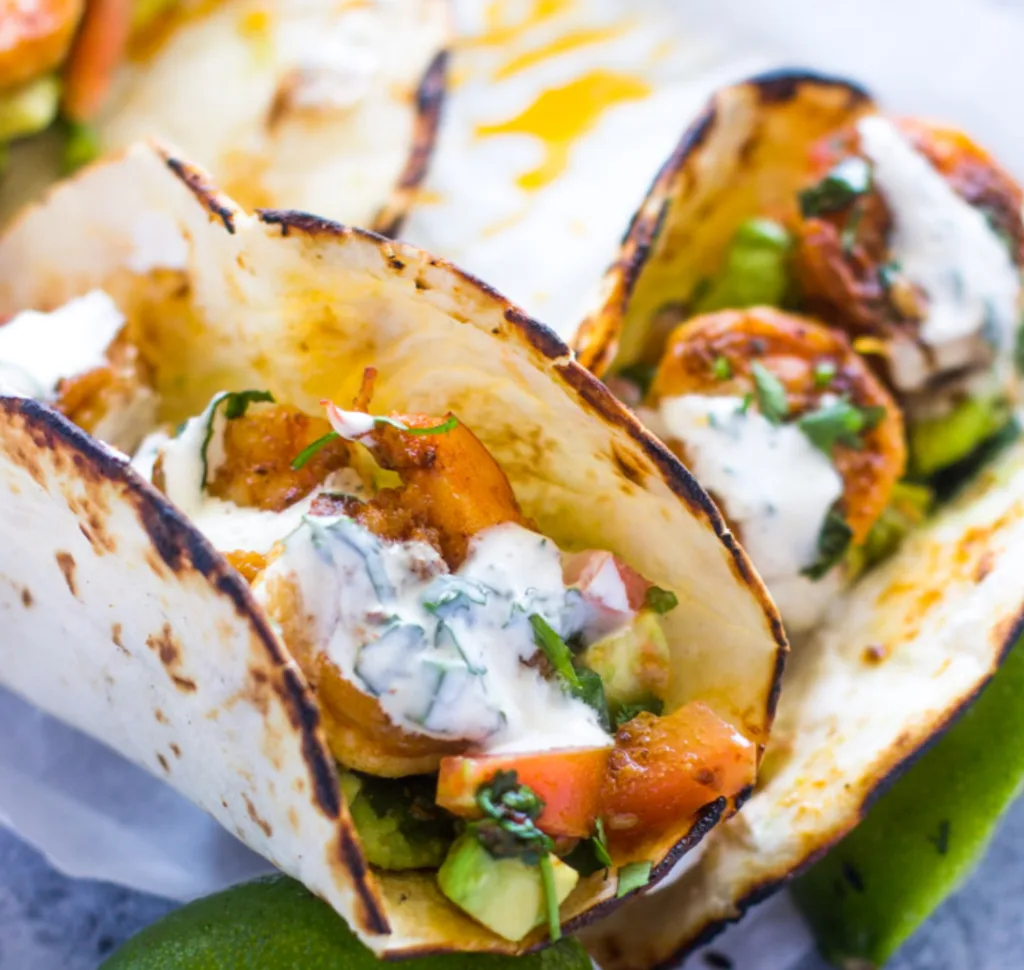 Spicy Shrimp Tacos with Avocado Salsa and Sour Cream Cilantro Sauce from Gimme Delicious Spicy Shrimp Tacos with Avocado Salsa and Sour Cream Cilantro Sauce from Gimme Delicious
