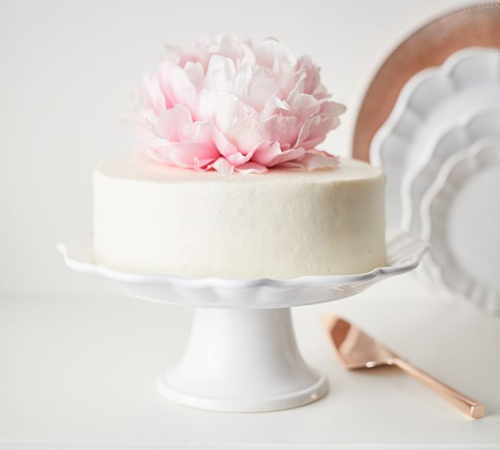 This Monique Lhuiller scalloped white cake stand at Pottery Barn shows off a birthday cake beautifully