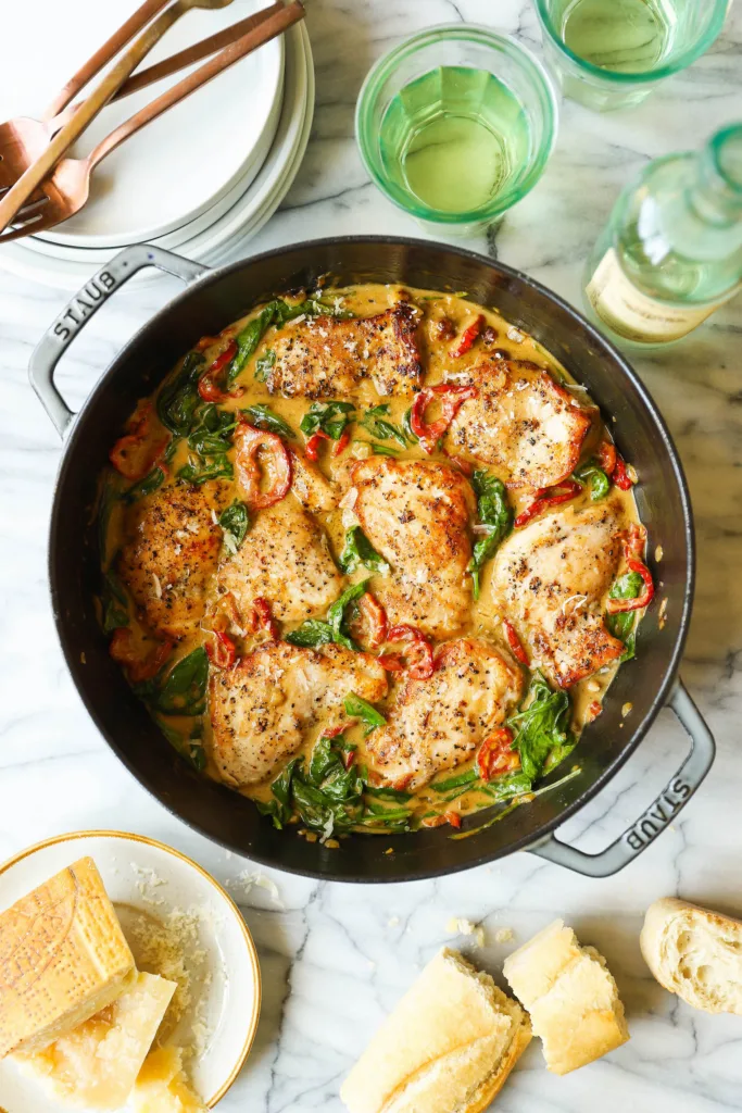 Skillet Sun Dried Tomato Chicken Thighs from Damn Delicious