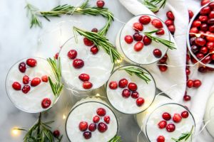 Fabulous make ahead holiday cocktail recipes you can prep ahead so that you can be merry with your guests, including this White Christmas Margarita Punch at How Sweet Eats