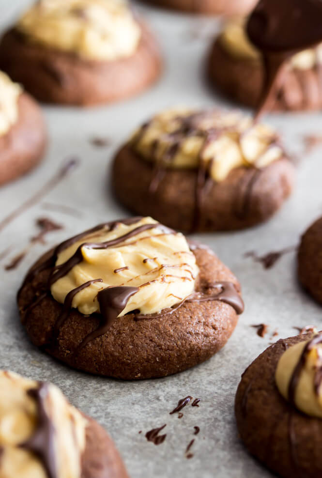 Holiday thumbprint cookies: Chocolate Peanut Butter Thumbprint Cookies | Sugar Spun Run