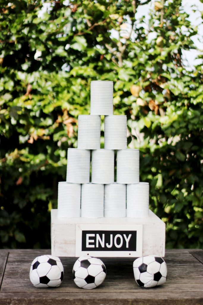 DIY backyard party game idea to help keep kids entertained: Go carnival style with white painted buckets and a small ball! 