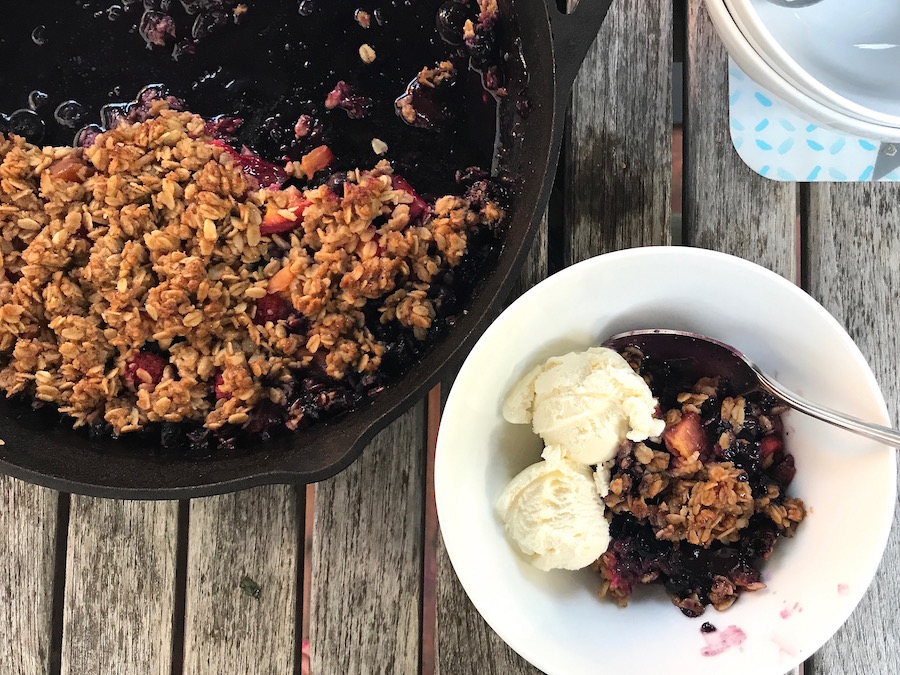 The perfect summer dessert on the grill: A fresh berry crisp with vanilla ice cream | Recipe © Jane Sweeney for Cool Mom Eats