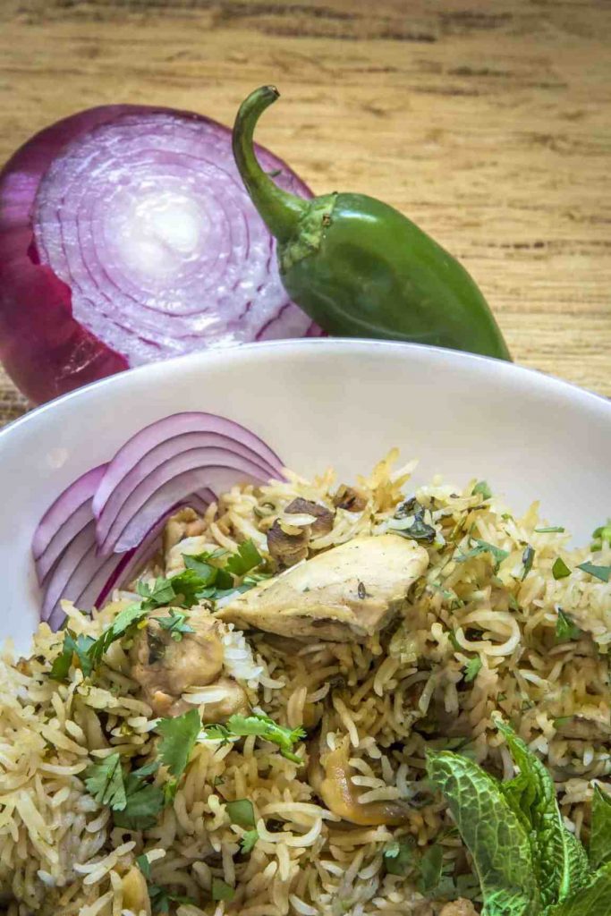 Instant Pot Chicken Biryani with Jasmine Rice cuts prep time down to 15 minutes, with 30 minutes of cook time! | Recipe: Urvashi Pitre at Two Sleevers