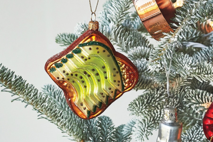 Move over candy canes. This avocado toast ornament is today’s Christmas tree must-have.