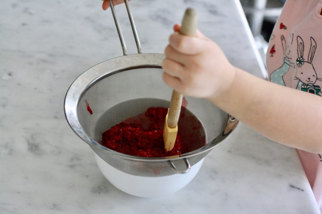 How to make natural pink frosting: Trying raspberry puree | ©Jane Sweeney for Cool Mom Eats