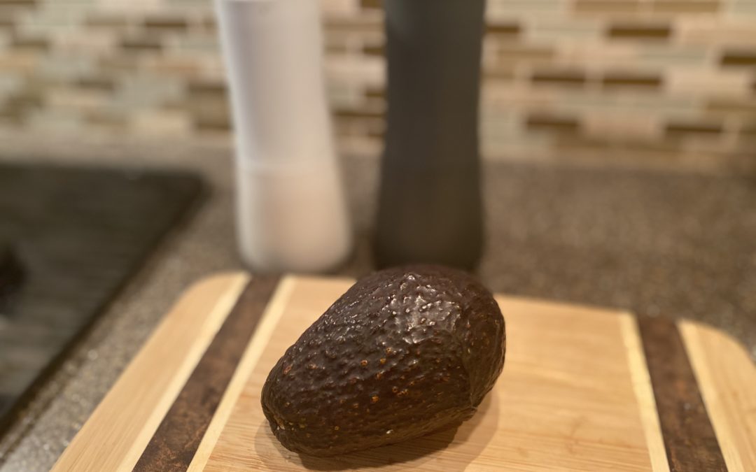How to keep an avocado from turning brown after you’ve cut it. (And it’s not what you think)