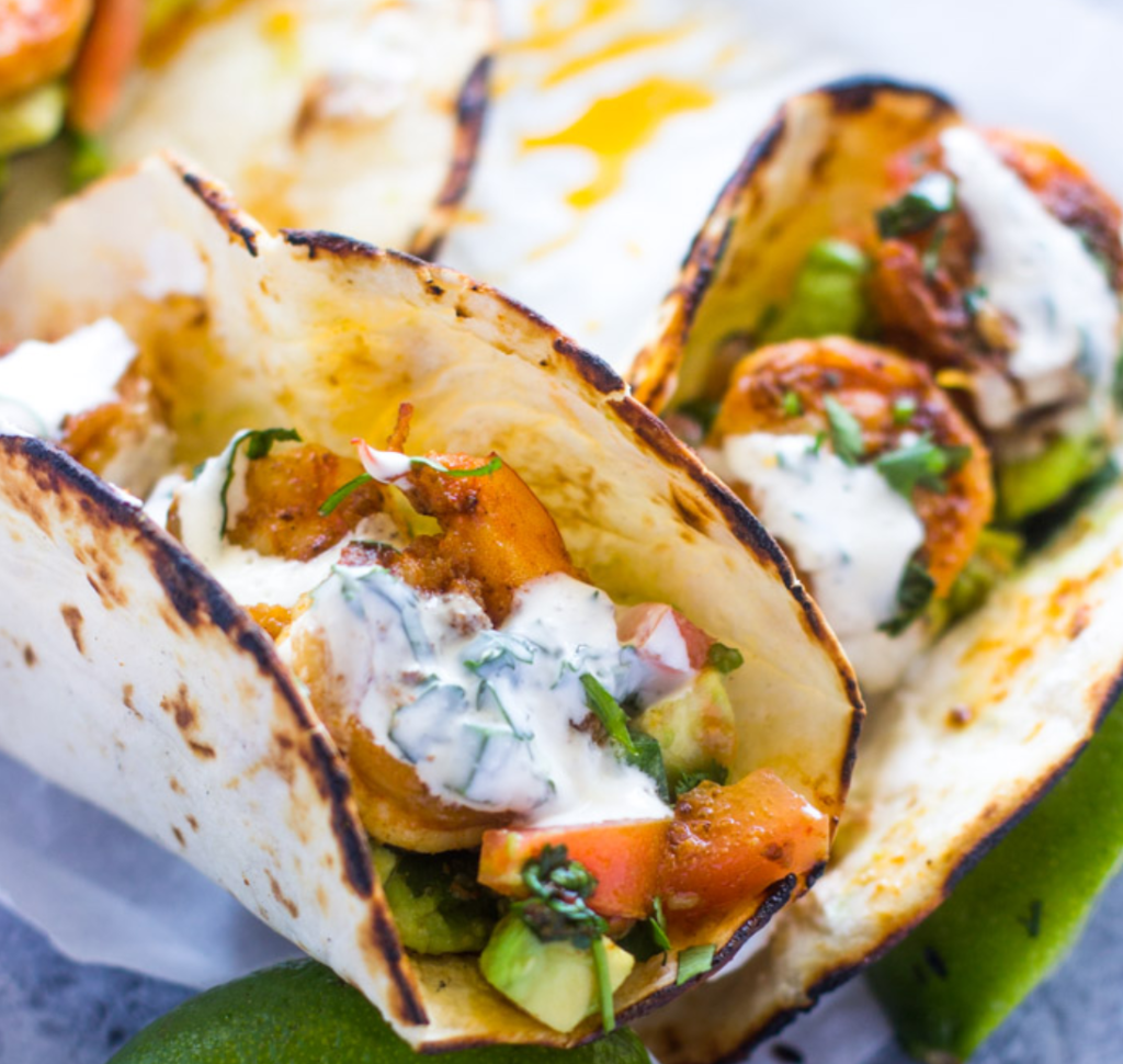 Spicy Shrimp Tacos with Avocado Salsa and Sour Cream Cilantro Sauce from Gimme Delicious