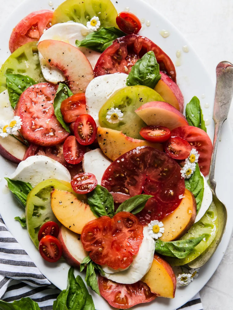Great meal ideas for a heat wave: Peach and Tomato Caprese Salad from The Modern Proper makes use of summer's best produce