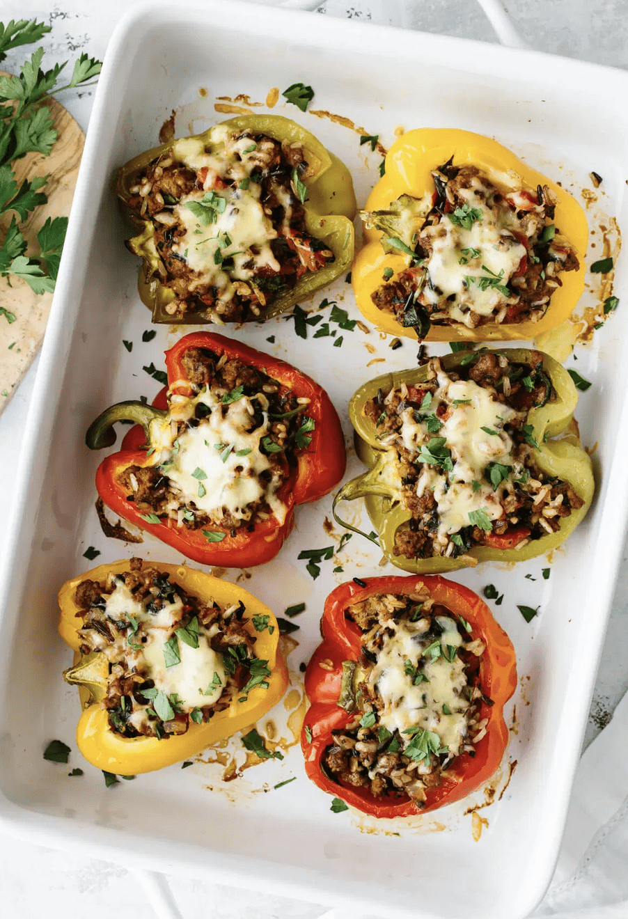Weekly Meal Plan featuring September produce: Stuffed Peppers from Downshiftology