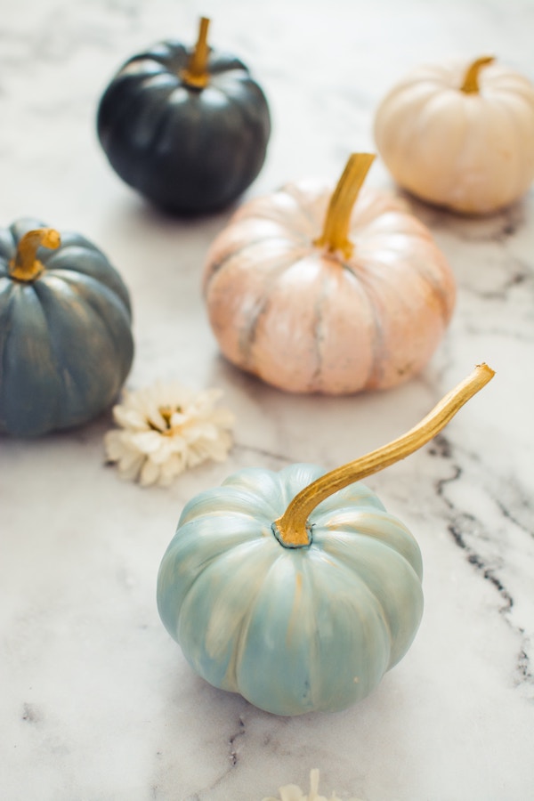 Decor ideas for a pumpkin carving party: Keep it as simple as a few decorative pumpkins or some simple flowers in mason jars