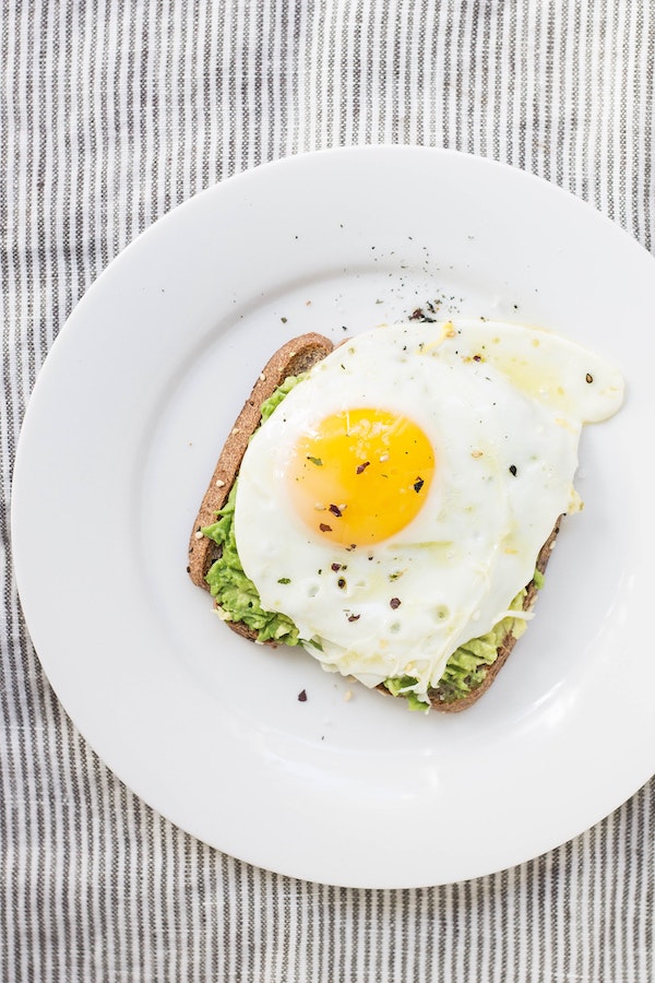 Avocado toast gets topped with an egg for a quick and healthy breakfast for teens