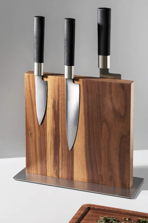 A magnetic knife block is a cleaner way to store kitchen knives. This beautiful one found at Wayfair