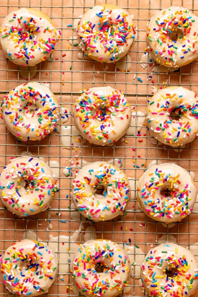 Vegan vanilla rainbow sprinkle donuts from Orchids and Sweet Tea